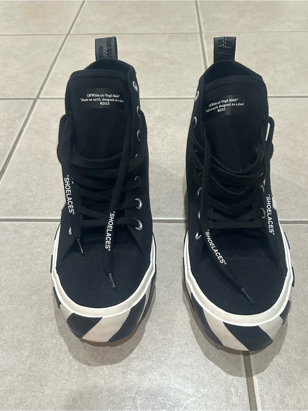 Off-White Black Canvas High-Top Sneakers with White Sole Accents